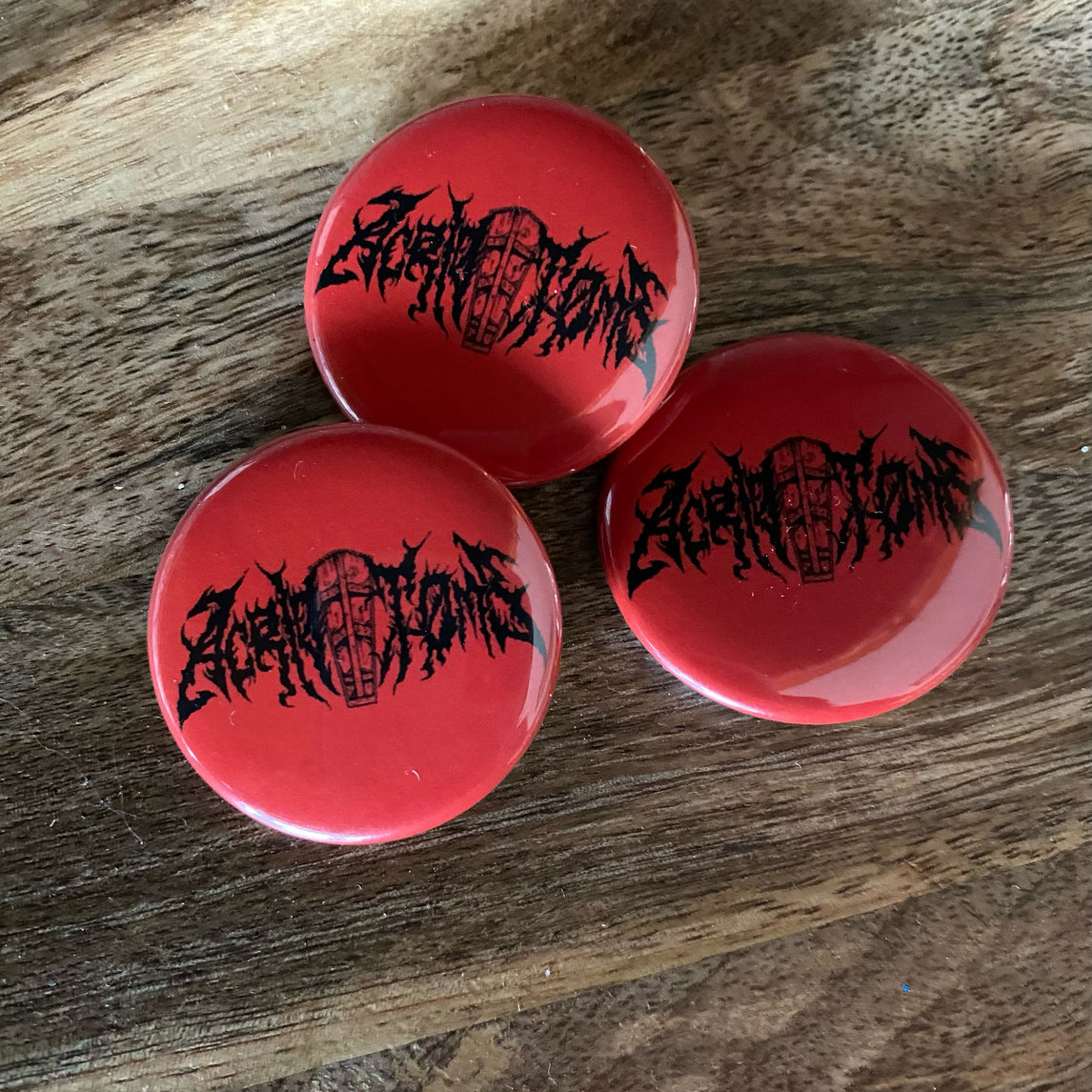 Acrid Tomb logo buttons